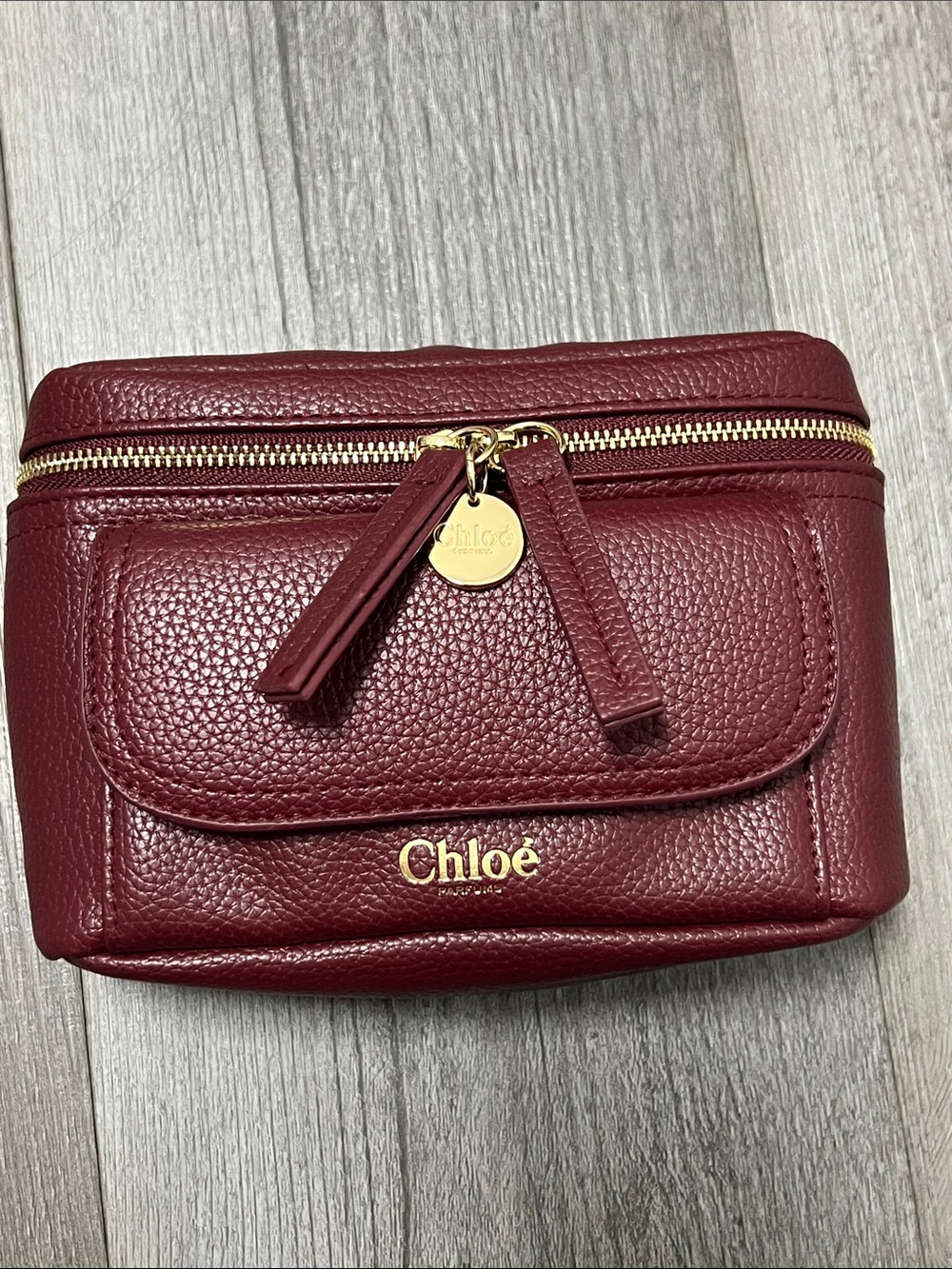 Chloe Parfums burgundy faux leather cosmetic pouch/ like new
